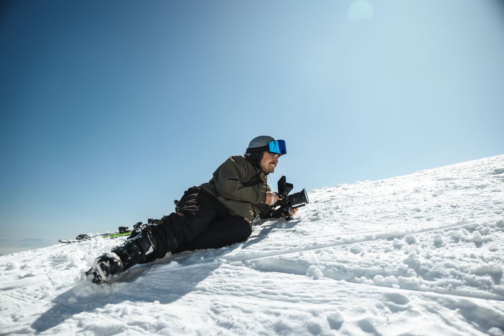 James Camp filming on a ski slope, Ruroc snowsports shoot