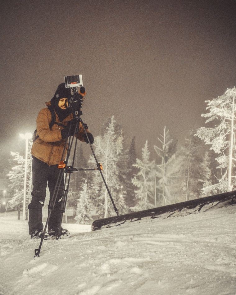 James Camp filming at night in the snow