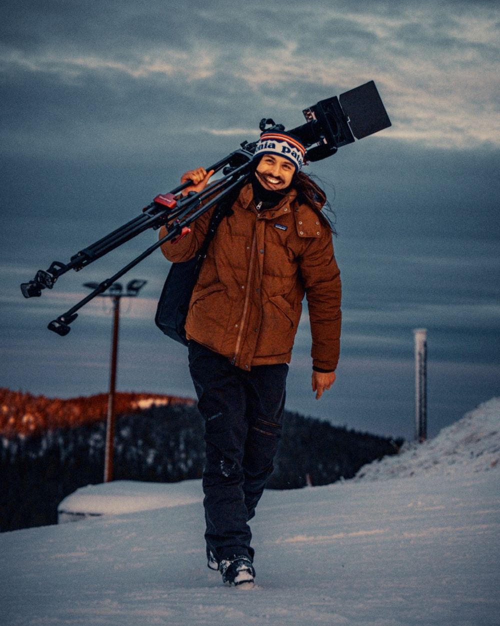 James Camp walking with the camera rig, dusk